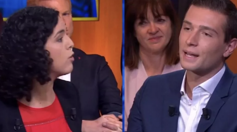 Débat télévisé entre deux responsables politiques face à face sur un plateau, échange tendu sous l’œil du public en arrière-plan.