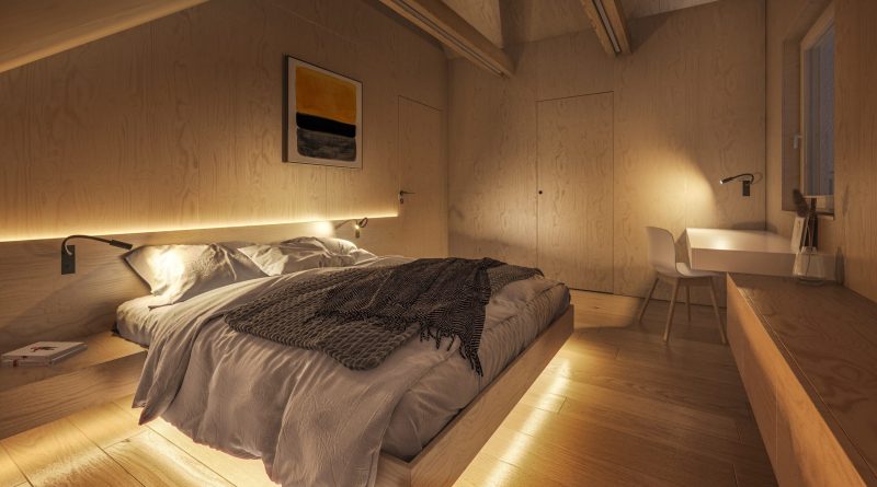 Chambre à coucher moderne et minimaliste avec un lit bas en bois clair, des draps clairs et une lumière douce intégrée créant une ambiance chaleureuse et apaisante.