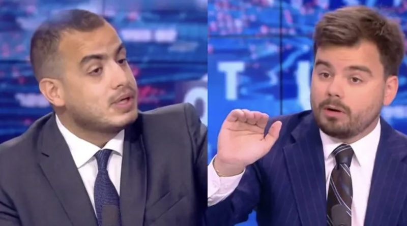 Face-à-face tendu entre deux intervenants sur un plateau de télévision d’actualité, l’un prenant la parole tandis que l’autre réagit avec un geste de la main, illustrant un débat animé ayant provoqué une vive polémique en direct sur une chaîne d’information.